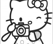 Coloriage et dessins gratuit Hello Kitty prend une photo à imprimer
