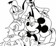 Coloriage Goofy, Donald et Mickey fiers de leur citrouille d'Halloween
