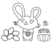Coloriage Lapin mignon avec des oeufs de Pâques et petit gâteau ps