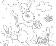 Coloriage Lapin peint l'oeuf de Pâques facile
