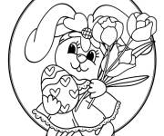 Coloriage Lapin tenant un œuf de Pâques avec des cœurs