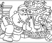 Coloriage et dessins gratuit Le Père Noël dépose des cadeaux sous le sapin à imprimer