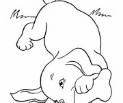 Coloriage Chien joue dans le jardin