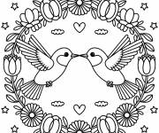 Coloriage Deux colibris planent dans un c&oelig;ur