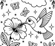 Coloriage Un colibri sirote le nectar à motif