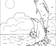 Coloriage et dessins gratuit Dauphins jouent au ballon à imprimer