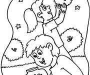 Coloriage Gar&ccedil;on et fille s'amusant avec les Lucioles