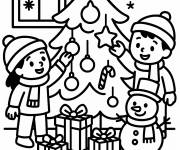 Coloriage Les amis d&eacute;corent le sapin de noel