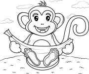 Coloriage Singe mignon mangeant une banane