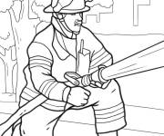 Coloriage Un pompier tient un tuyau pour &eacute;teindre un incendie