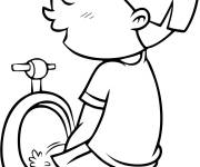 Coloriage L'enfant fait pipi dans la toilette