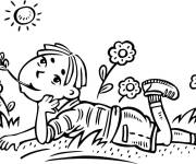 Coloriage Un enfant r&ecirc;vant dans un champ