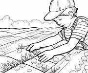 Coloriage Mains d' un enfant plantant des graines dans le champs