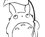 Coloriage Totoro se prot&egrave;ge de la pluie avec la feuille