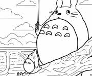 Coloriage Totoro tenant un parapluie avec les petits Totoros