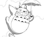 Coloriage Totoro volant sur un parapluie