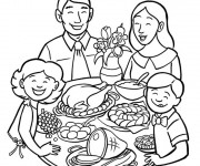 Coloriage La Famille réunie autour de repas