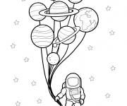 Coloriage Un astronaute tient des plan&egrave;tes dans le syst&egrave;me solaire