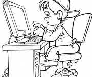 Coloriage Le petit enfant sur un ordi