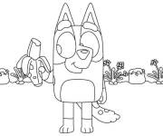 Coloriage Le chien Bluey mange une banane