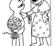 Coloriage Elmo offre un bouquet de fleur &agrave; sa grand mere