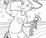 Coloriage Andy en jouant avec Buzz et Woody