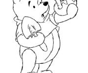 Coloriage Winnie a trouv&eacute; une pomme
