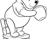 Coloriage et dessins gratuit Winnie est debout sur une chaise à imprimer
