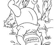 Coloriage Winnie est tomb&eacute; dans un pot de miel