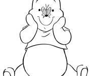 Coloriage Winnie l'ourson avec un papillon sur le nez