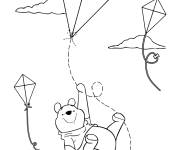 Coloriage Winnie l'ourson fait voler un cerf-volant