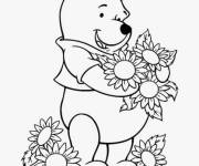 Coloriage Winnie ourson avec des fleurs