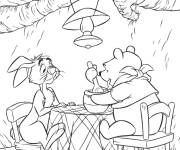 Coloriage Winnie ourson pr&eacute;pare son plat pr&eacute;f&eacute;r&eacute;
