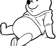 Coloriage Winnie ourson se d&eacute;tend