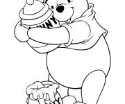Coloriage Winnie Pooh avec deux pots de miel
