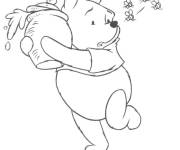 Coloriage Winnie pourchass&eacute; pour son miel