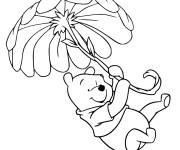 Coloriage Winnie suspendue &agrave; une fleur g&eacute;ante