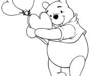 Coloriage Winnie tenant des ballons