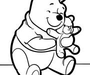 Coloriage Winnie tenant un ours en peluche