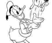Coloriage Donald Duck s'amuse avec une grenouille