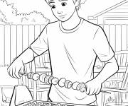 Coloriage garcon qui fait griller des brochettes
