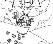 Coloriage Chauve-souris tenat un panier de bonbons d'Halloween