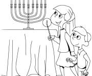 Coloriage Enfants pr&eacute;s de la table de Hanoucca