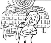 Coloriage Gar&ccedil;on devant la table de hanoucca juif