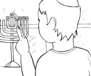Coloriage et dessins gratuit Sc&egrave;ne du gar&ccedil;on allumant le Hanukkah à imprimer