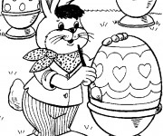 Coloriage Lapin artiste dessine sur Oeuf de Pâques