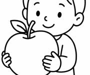 Coloriage Gar&ccedil;on tenant une pomme de Roch Hachana
