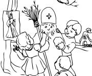Coloriage Les enfants construisent un Saint Nicolas de neige