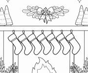 Coloriage Les bas de No&euml;l au-dessus de la chemin&eacute;e