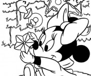 Coloriage Minnie Mouse s'amuse avec ses jouets